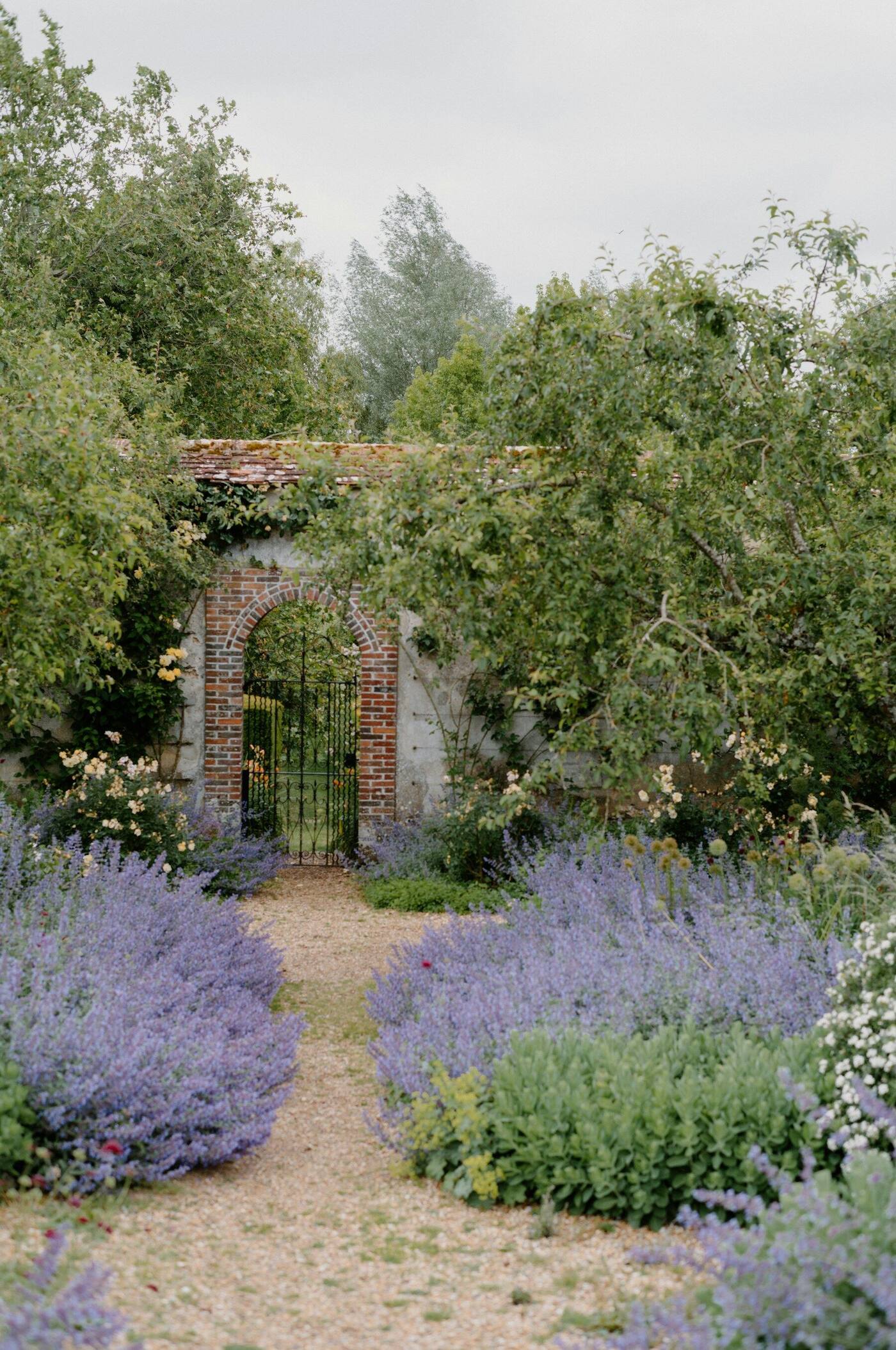 Garden inspiration: a brick arch and lavender lined path